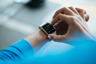 Person checking the time on their smart watch