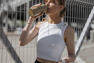 Woman drinking collagen post-workout