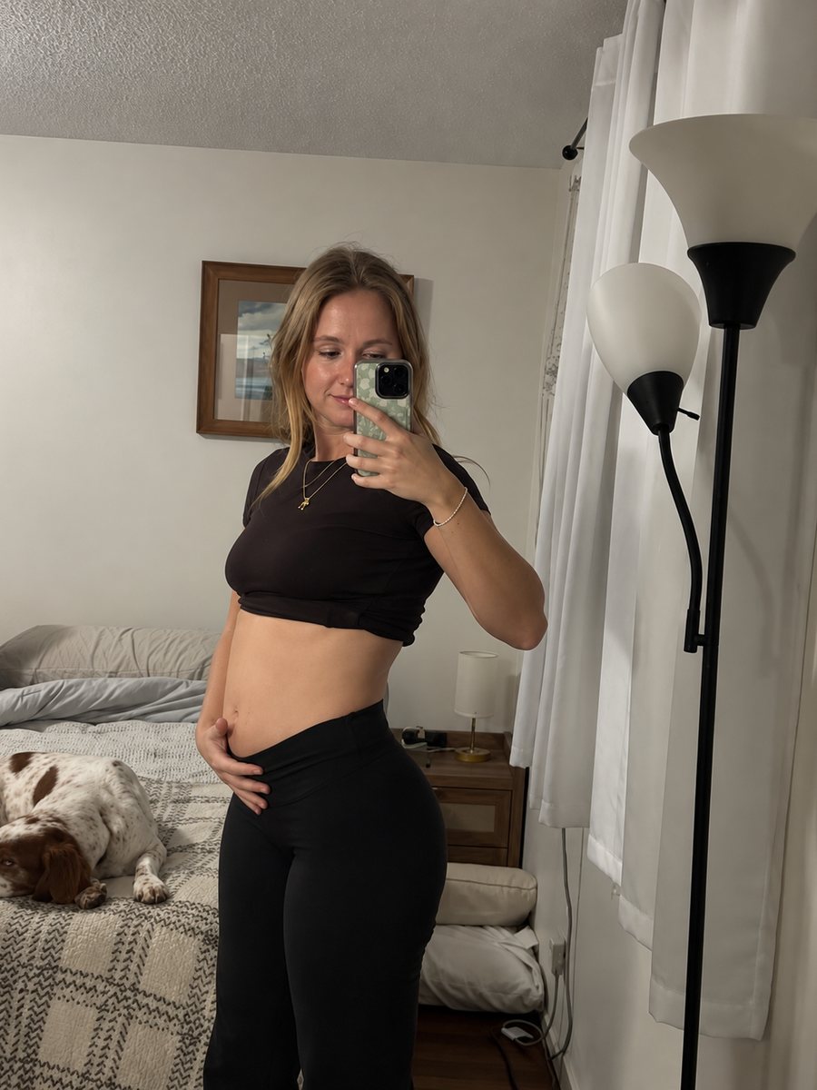 Woman showing her bloated stomach