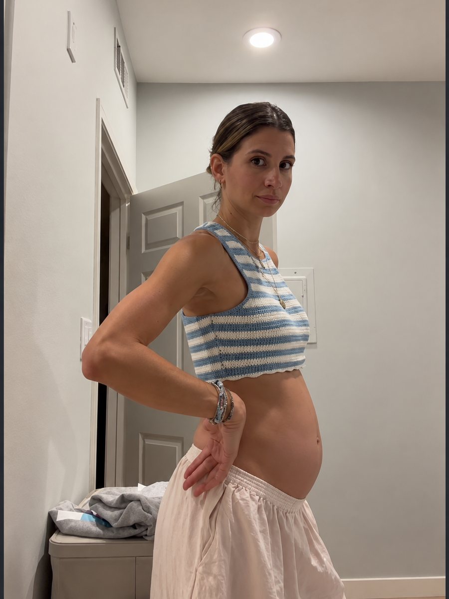 Woman showing her bloated stomach