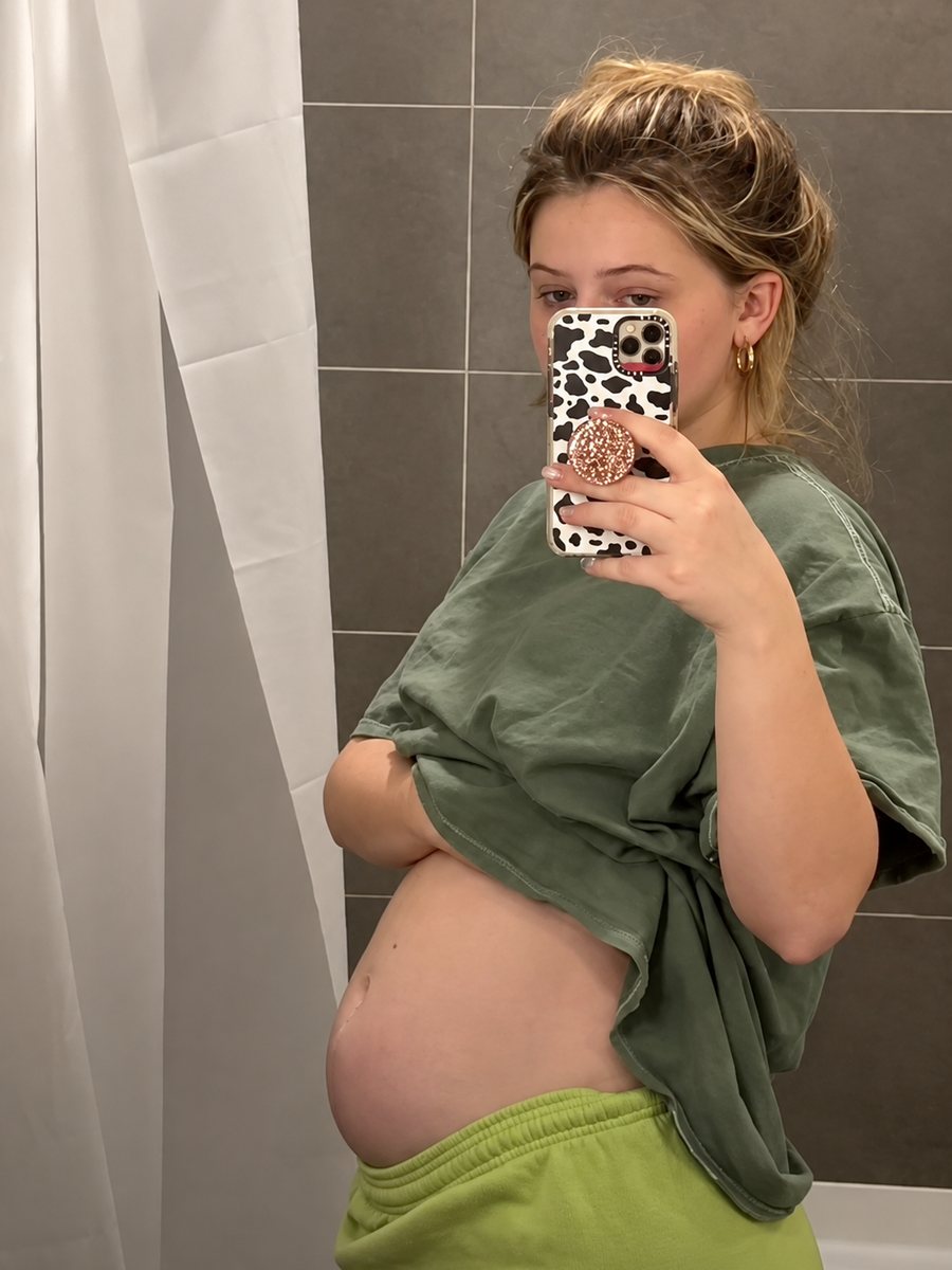 Woman showing her bloated stomach