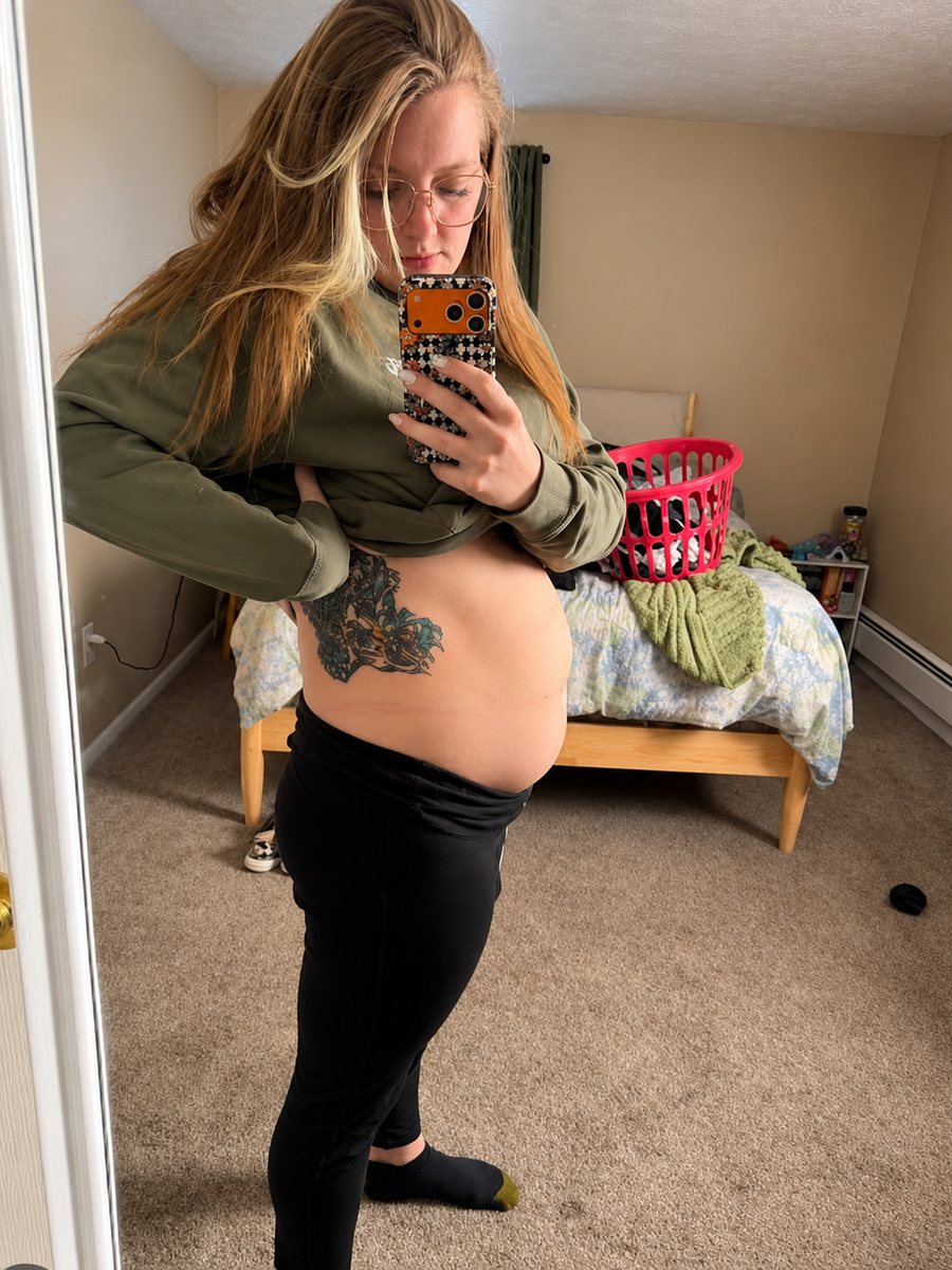 Woman showing her bloated stomach