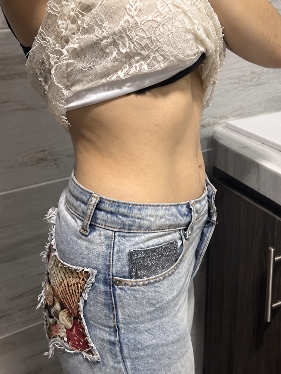 Woman showing her bloated stomach