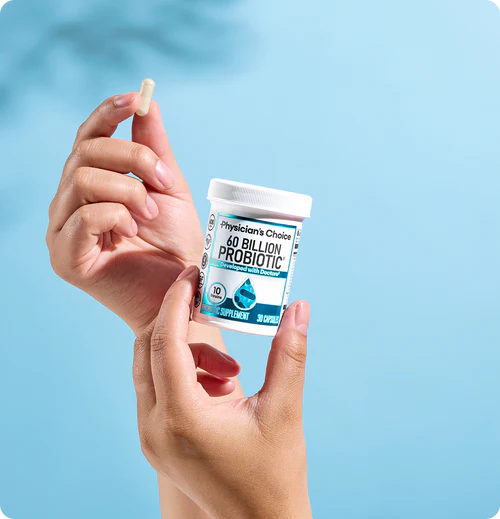 Hand holding a 60 Billion Probiotic capsule